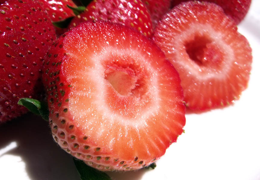 Fragaria ananassa (strawberry); close-up of sectioned fruit.
